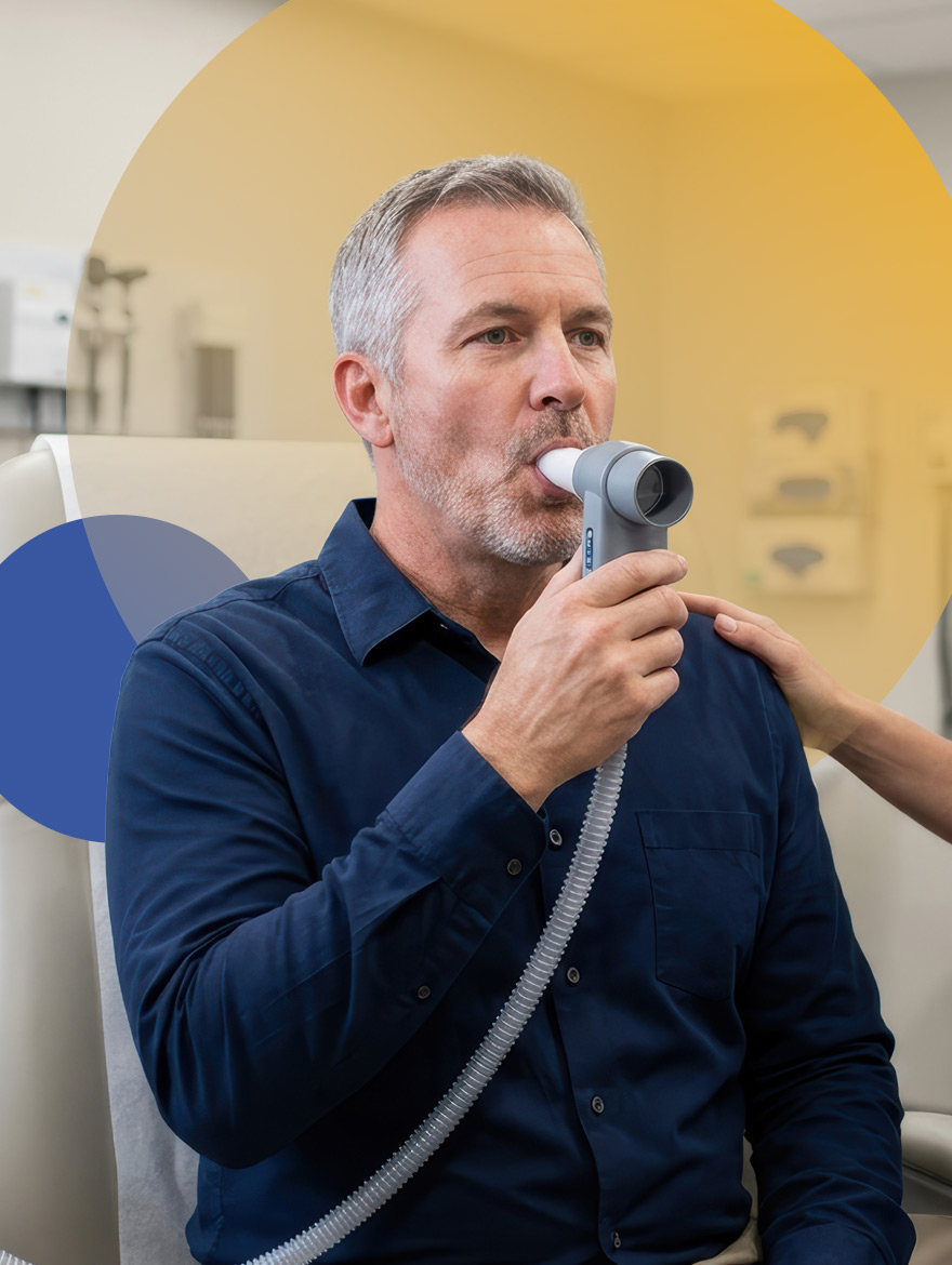 Patient using respirometer